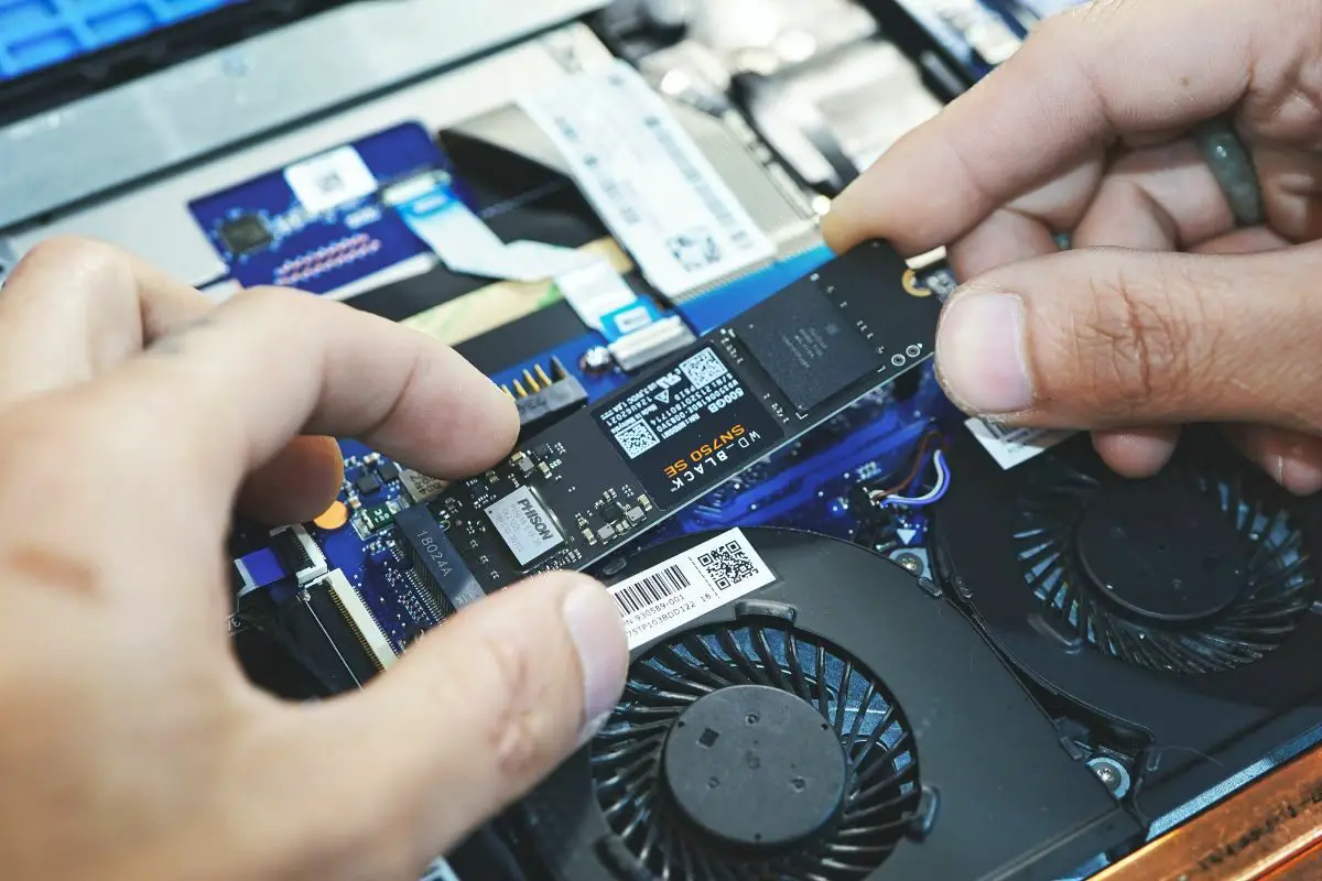 Hands Holding Internal SSD Card