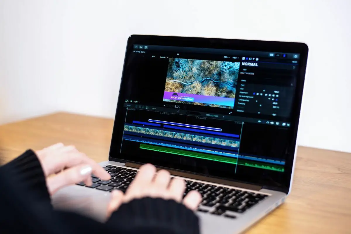Person Editing a Video on Laptop