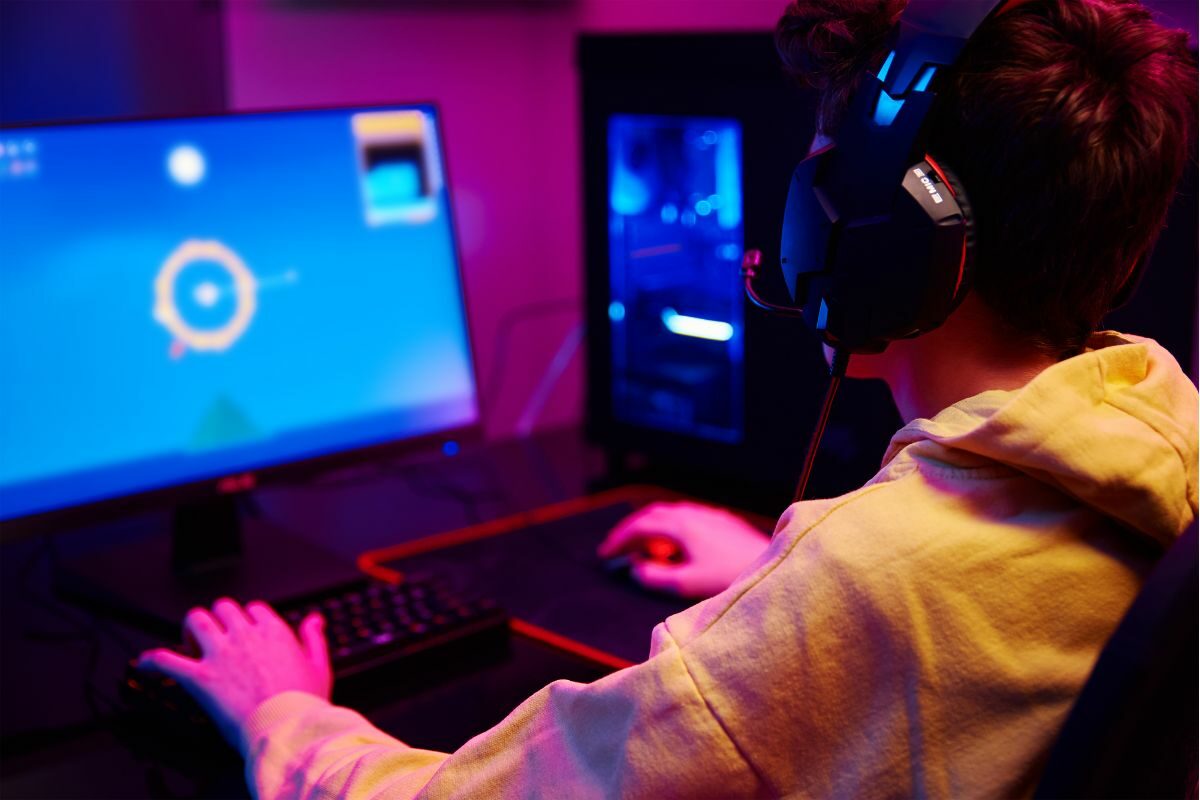 Young Teen Playing Online PC Game