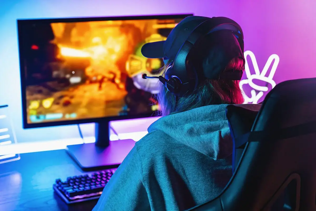 Girl Playing Shooting Online Video Game on PC