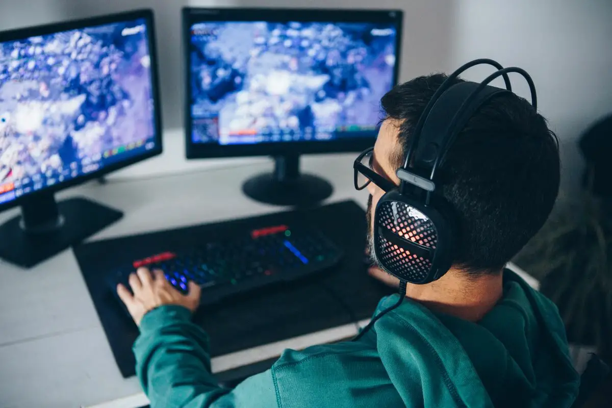 Man Playing Multiplayer Games on Desktop PC