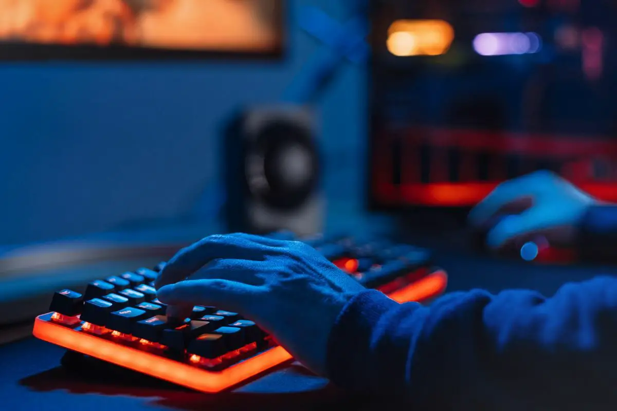 Professional Gamer Playing Online Game Using RGB Keyboard